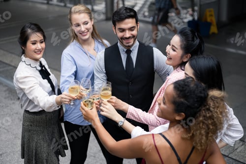 Preview: Group of business people celebrate by drinking wine.