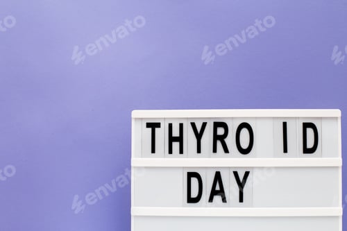 Preview: inscription international thyroid day on purple background. copy space