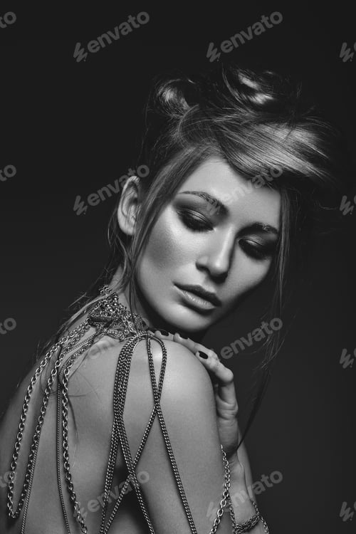 Preview: beautiful girl with many golden and bronze chains