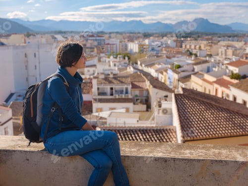 Preview: Young woman exploring historic castle in Denia