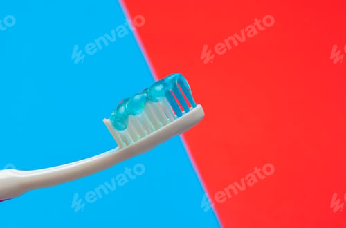 Preview: Flat lay composition with manual toothbrushes on color background, close up