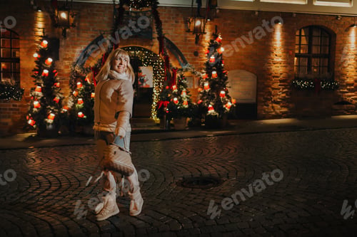 Preview: A woman walks through the New Year's city of Vilnius in winter.Lithuania