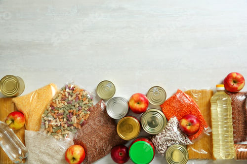 Preview: Many different products and space for text on white wooden background, flat lay. Food donation