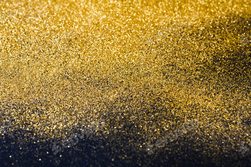 Preview: Golden glitter sand texture on black, abstract background.