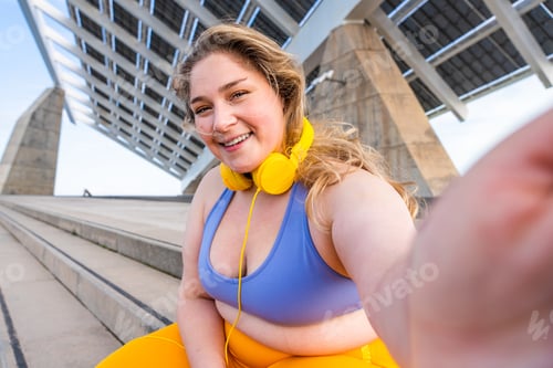 Preview: Beautiful plus size young woman outdoors