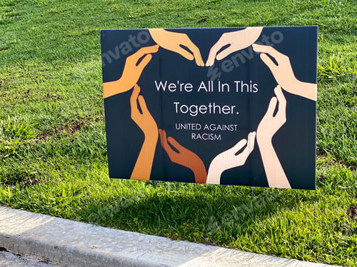 Preview: We are all in this together United against racism sign with words in the wild.