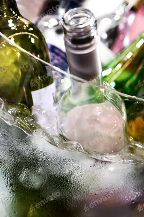 Preview: Many wine bottles in a glass bucket