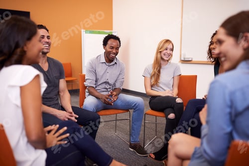 Preview: Multi-Cultural Group Of Men And Women At Mental Health Group Therapy Meeting
