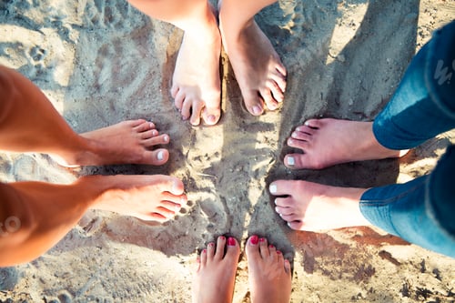 Preview: Top view image of feet of the female friends