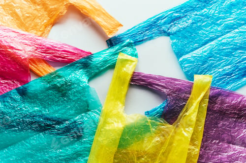 Preview: Several bright colored disposable plastic bags on the plane