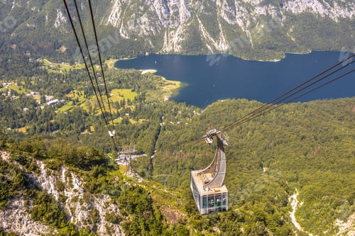 Preview: Gondola ski lift overlooking lake
