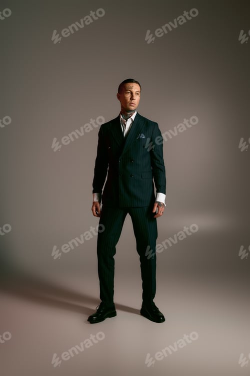 Preview: Charismatic young man showcasing elegant style in a modern, minimalistic setting