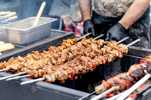 Preview: Chef Grilling Meat Kebabs Outdoors