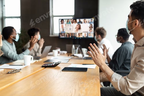 Preview: Diverse businesspeople making online video call to employees
