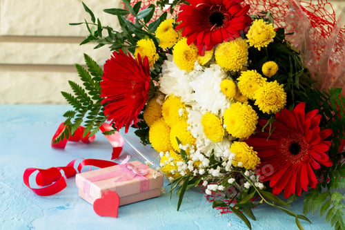 Preview: Mother's Day background or greeting card. Congratulatory sheet of paper withbouquet of gerbera