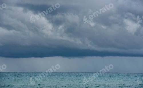 Preview: Seascape dramatic stormy clouds. Strom in the horizon. Rainy winter day in the ocean