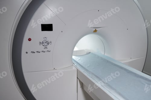 Preview: New MRI scan equipment with long table covered with napkin
