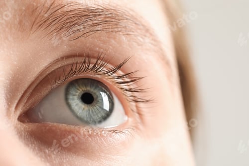 Preview: Macro photo of woman with beautiful eyes on light background