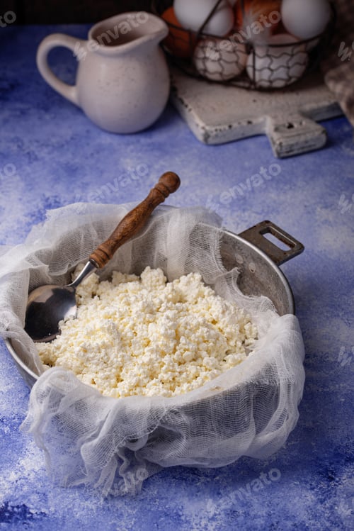 Preview: Homemade cottage cheese on blue background