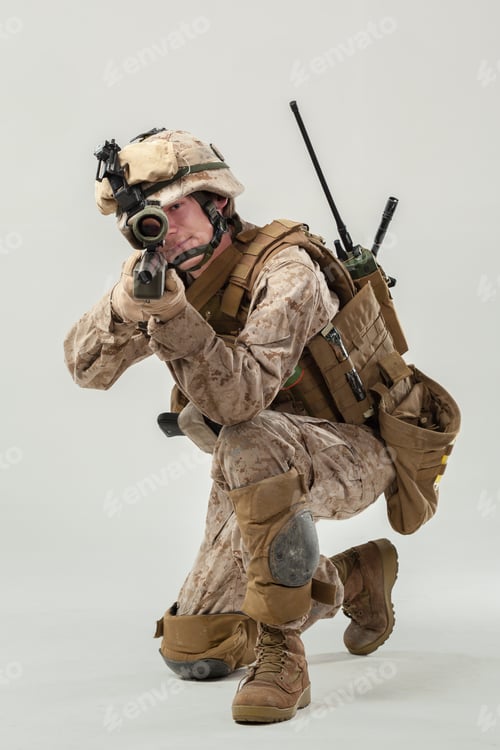 Preview: Soldier in combat gear aiming with weapon during training in a studio environment