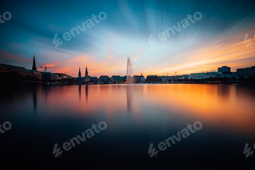 Preview: Panoramic view of Binnenalster, Inner Alster Lake in golden and blue evening light at sunset