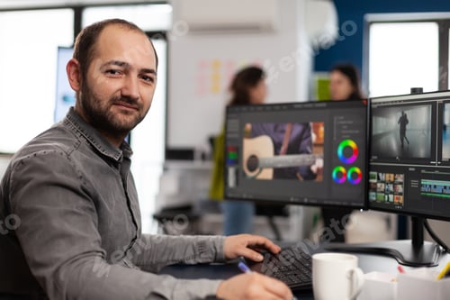 Preview: Creative designer artist man looking at camera smiling