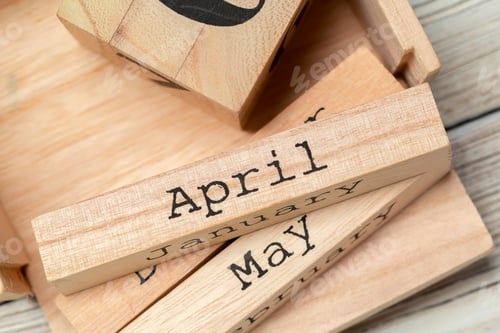 Preview: top view of parts of wooden calendar on dark wooden tabletop