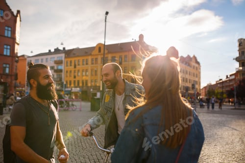 Preview: Three smiling friends in town square