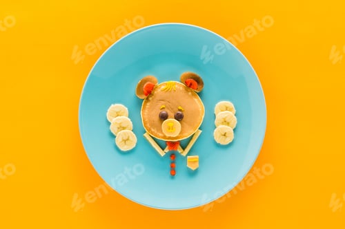 Preview: top view of creatively styled healthy breakfast on colorful tabletop