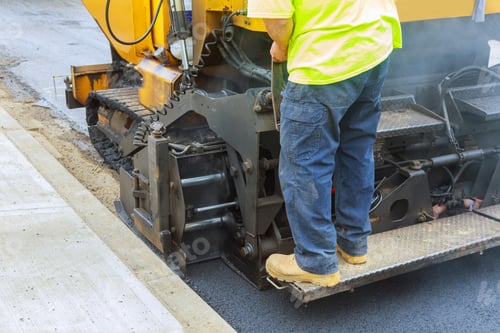 Preview: Workers making asphalt with shovels at road construction paving a road
