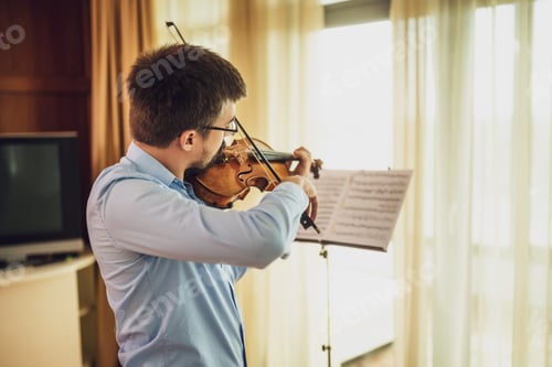 Preview: Man practicing on violin