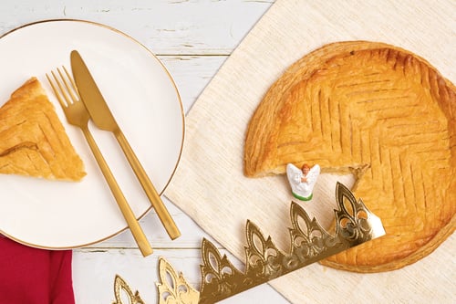 Preview: King cake or galette des rois in French. Traditional epiphany pie with paper crown and tiny charms