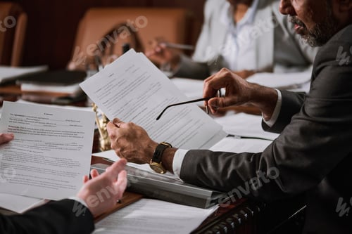 Preview: Ceo holding eyeglasses and contract
