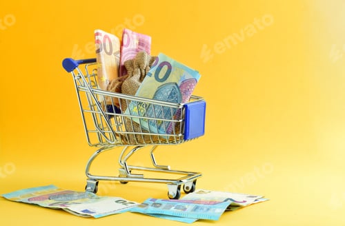 Preview: Shopping cart with euro banknotes isolated on a yellow background - economic concept