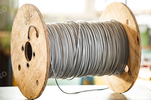 Preview: Giant skein of gray wires on a wooden reel