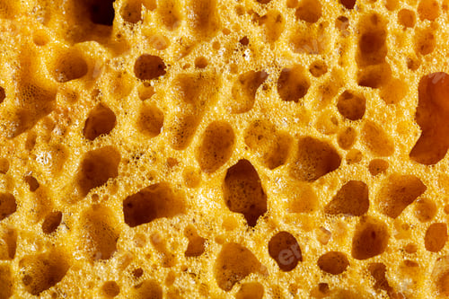 Preview: The texture of a yellow washcloth for the shower.