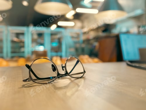 Preview: Reading glasses on top of the table.