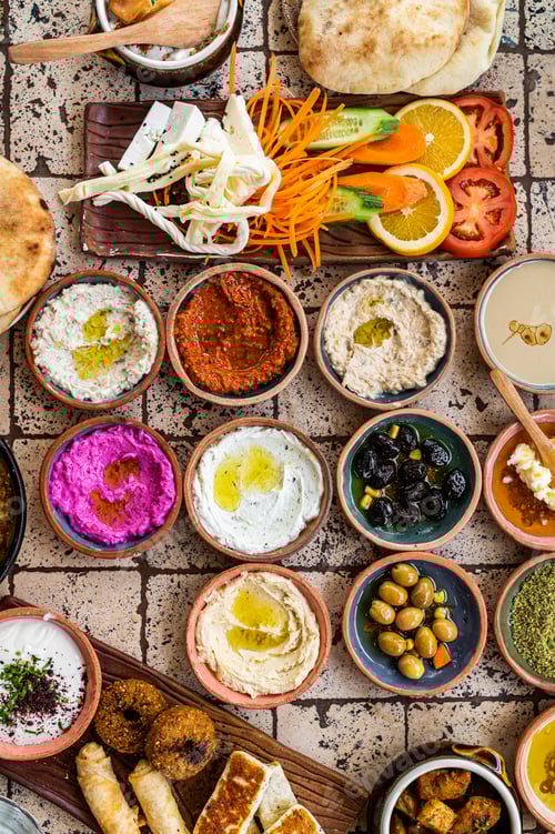 Preview: Turkish family breakfast table with pastries, vegetables, greens, spreads, cheeses, fried eggs