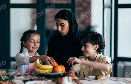 Preview: Traditional arabian family from Dubai spending time together at home