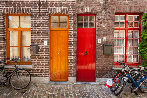 Preview: Doors of old houses and bicycles in european city Bruges (Brugge
