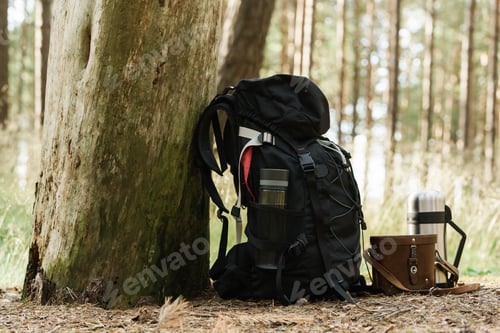 Preview: Traveler's backpack with supplies on the ground
