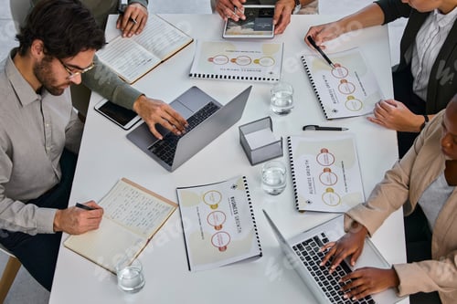 Preview: Shot of a group of businesspeople working together to get the projects done at the office