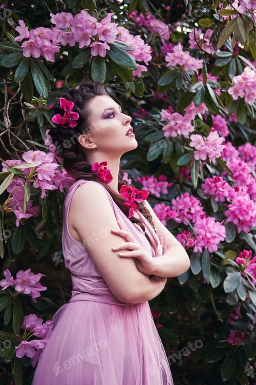 Preview: girl in dress in rhododendron garden