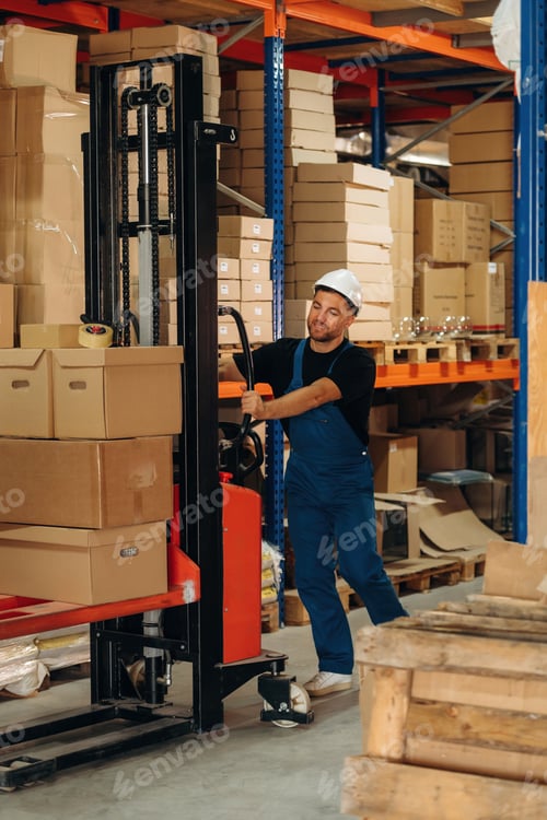 Preview: Moving stuff by using forklift. Man in uniform is working in the storage with packages for shipment