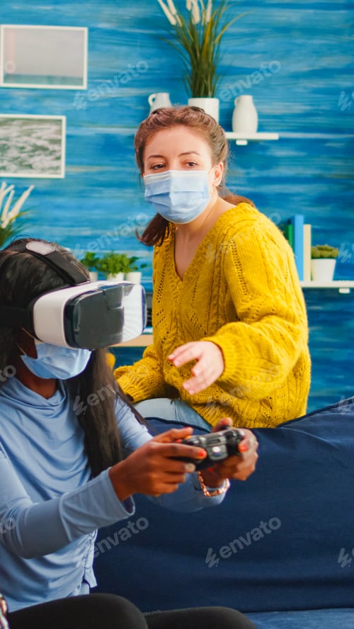Preview: Mixed group of people guiding black woman with vr headset playing virtual video