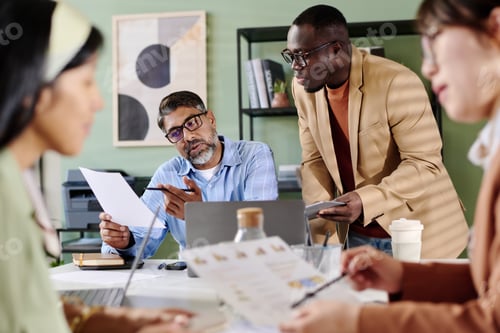 Preview: Discussing Business Strategy in Modern Office Setting