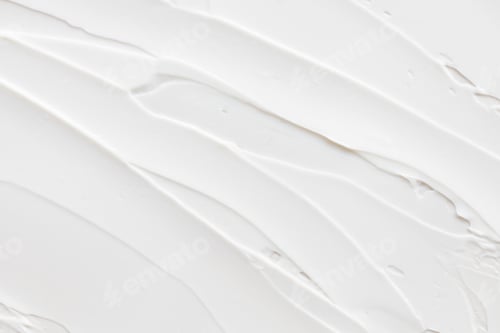 Visualização: Amostra de textura de creme branco, cosméticos para rosto e corpo em um fundo cinza claro isolado