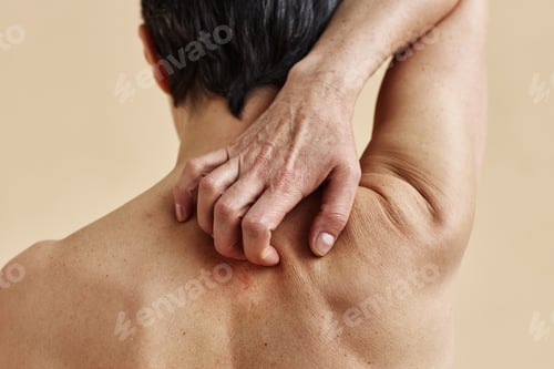 Preview: Closeup of mature woman scratching bare back a