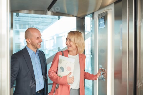 Preview: Business people standing in the elevator