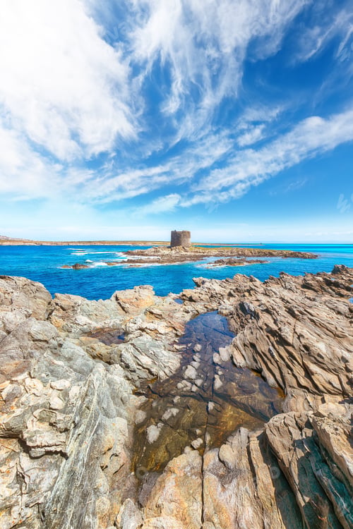 Preview: Unbelivable morning view of famous La Pelosa beach and rocky shore near Torre della Pelosa